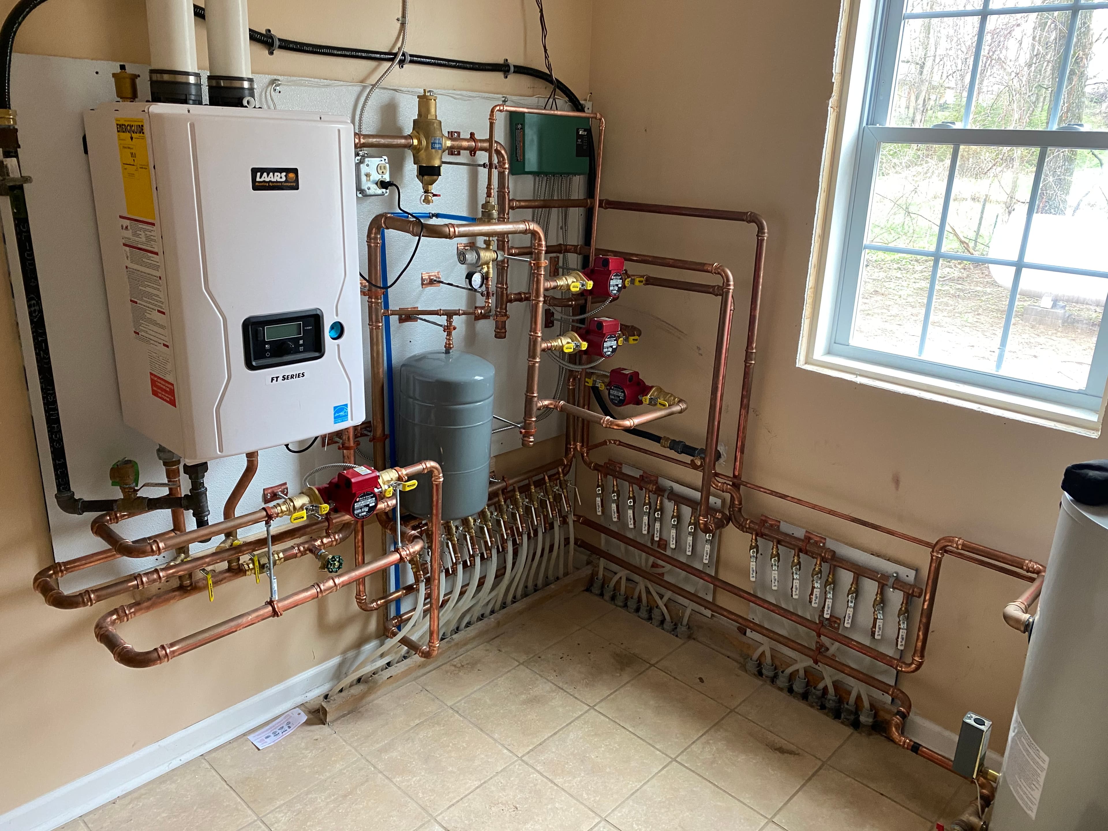 Laars boiler with copper manifold distribution system and expansion tank