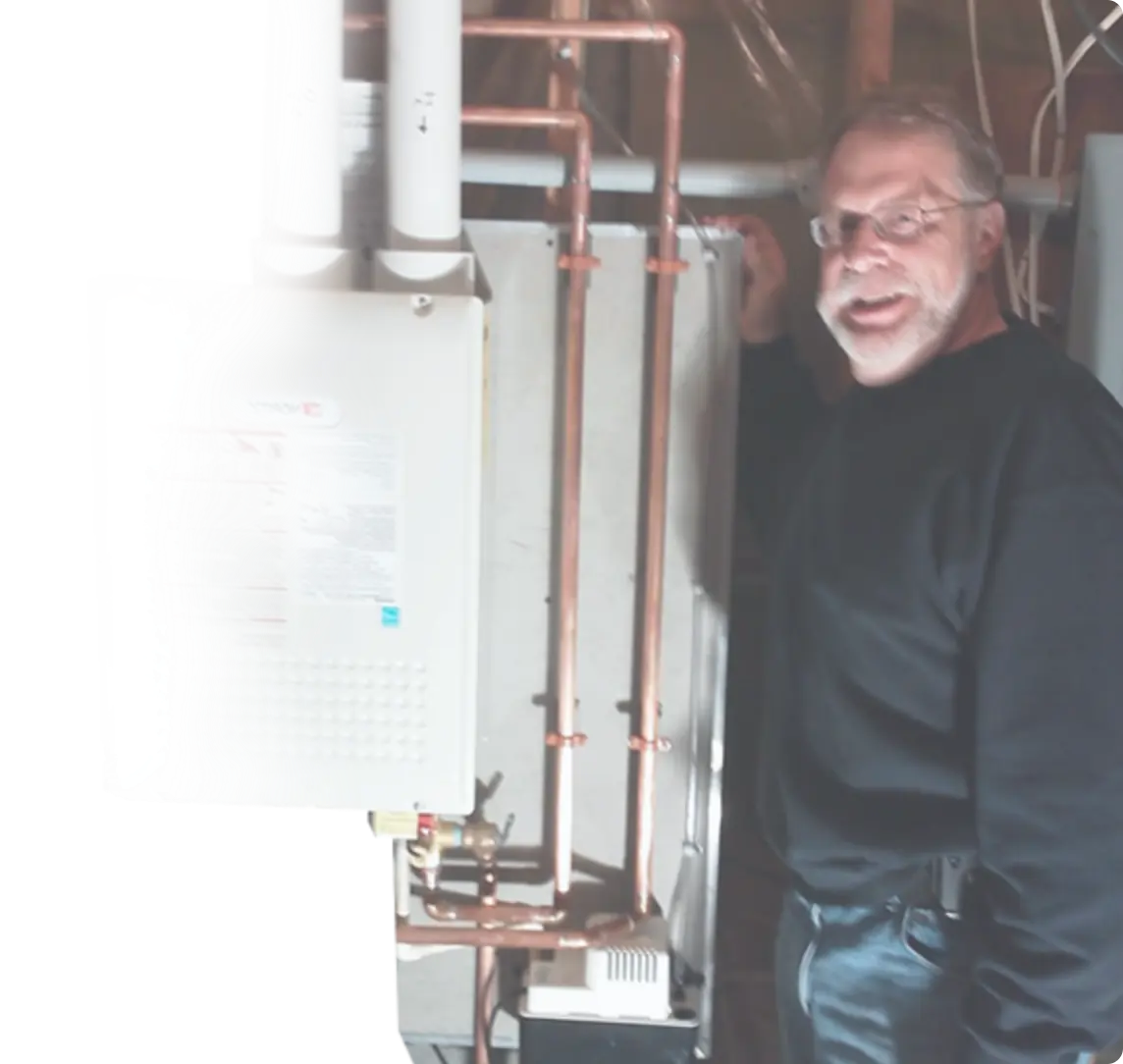 image of a man standing next to a water heater